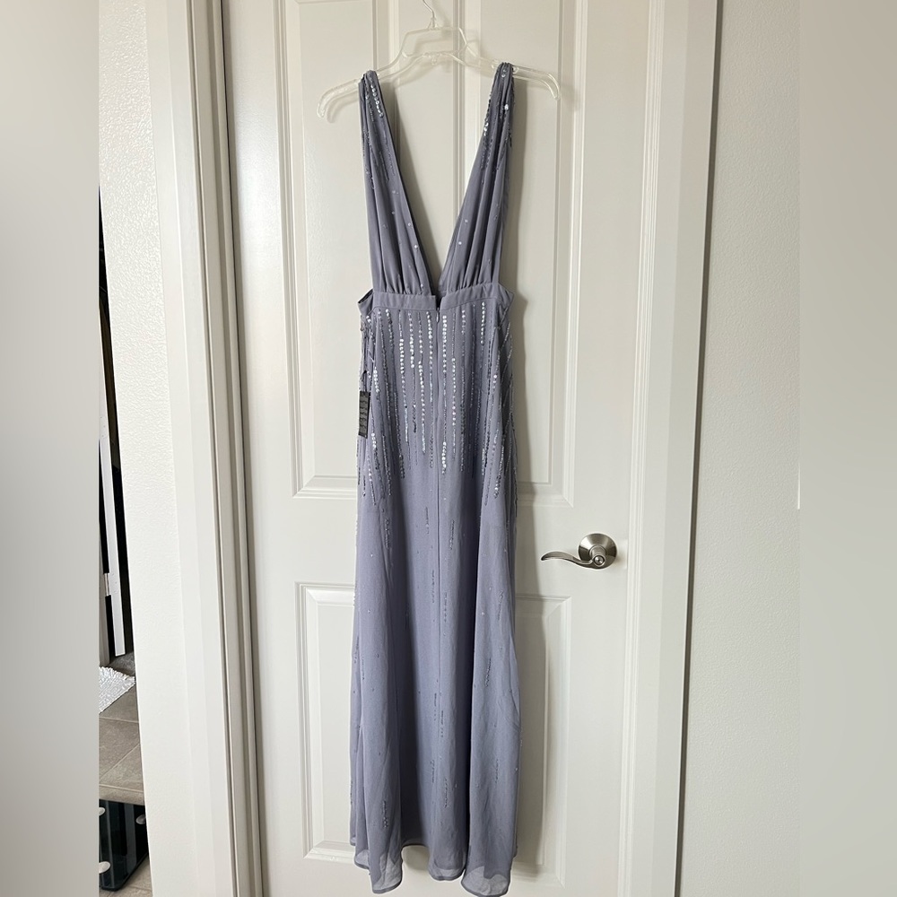 Brand new beautiful sequin dress with deep V